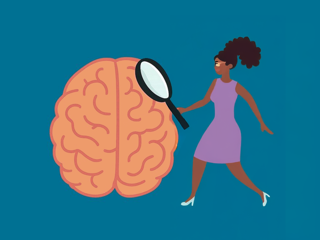 Frau, die mit einer Lupe ein Gehirn näher betrachtet